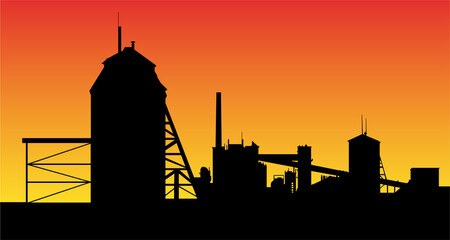 Oil shale processing plant silhouette on background of sunset. Technical buildings and conveyor belt.