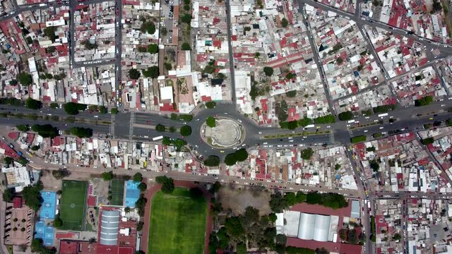  Aerial View in Queretaro Mexico, roundabout with a highway, Cinematic Drone Timelapse of "El Tanque", UNESCO World Heritage Site
