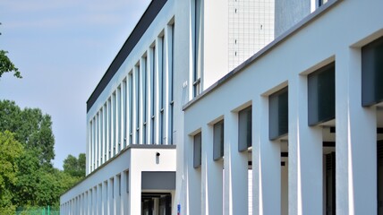 The glazed facade of an office building with reflected sky. Modern architecture buildings exterior background.