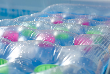 close up of a vibrant, green, wet air mattress