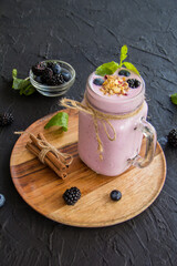Healthy smoothie of fresh summer berries. Creative atmospheric decoration