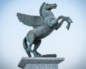 A statue of Pegasus, the Mythical Winged Horse, emblem of the city,  Pegasus square in Corinth...