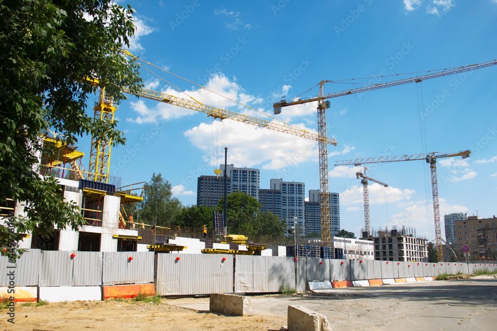 Wall mural construction site with cranes. construction site with a blue sky