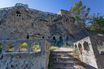 Civic medieval village. Medieval monastery built into the rock of the mountain. Ancient buildings.