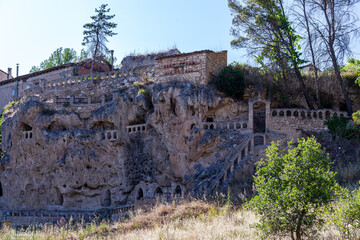 Civic medieval village. Medieval monastery built into the rock of the mountain. Ancient buildings.
