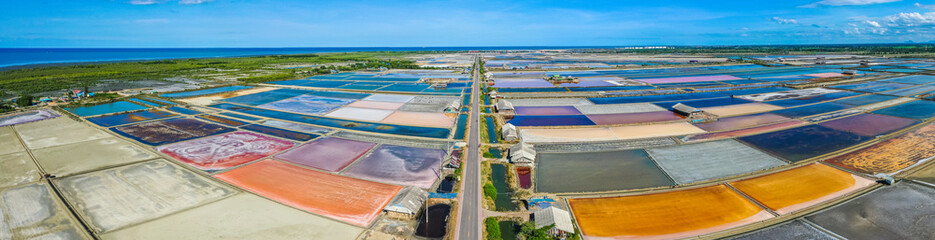 Phetchaburi Salt flats Naklua, farms and farmers collecting salt in Phetchaburi, Thailand