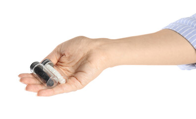 Woman holding natural dental floss on white background, closeup
