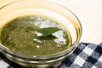 Closeup to bowl with delicious pesto sauce