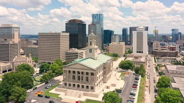 Aerial view of Nashville skyline with slow rotation around the State Capitol. Nashville is the capital and most populous city of Tennessee, and a major center for the music industry