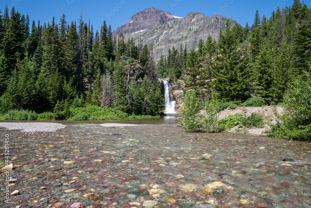 Wall mural beautiful running eagle falls waterfall in the two medicine area of glacier national park montana