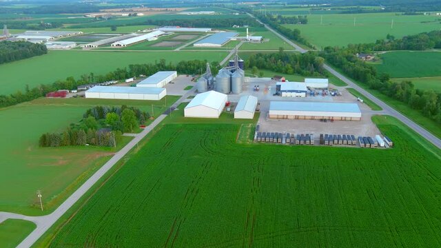 Family farms have evolved into larger, more efficient industrial operations, aerial view.
