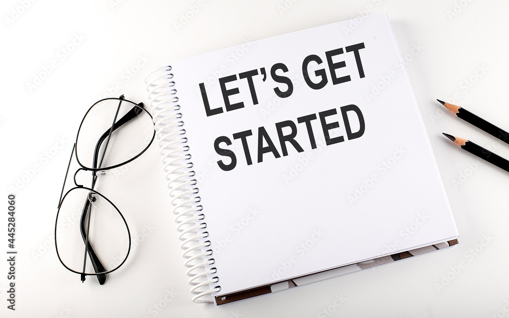 Poster notepad with text let's get started . white background. business concept