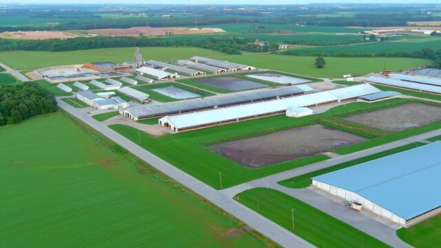 Family farms have evolved into larger, more efficient industrial operations, aerial view.
