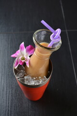 Thai ice milk tea or coffee bandung with boba bubble pearl in glass jar and straw on wood background asian beverage menu