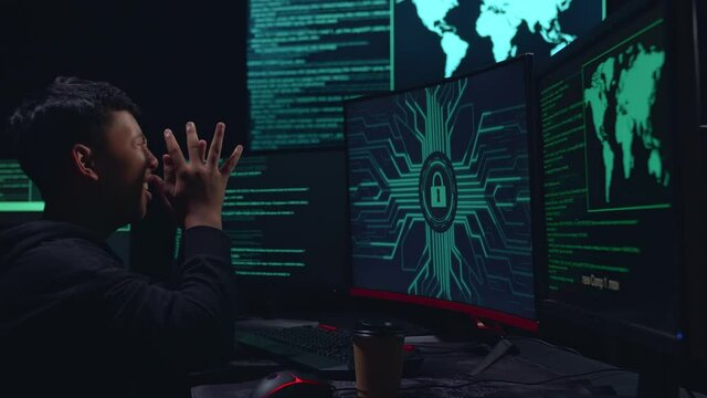 Asian Boy Hacker Upset With Lock Key On Computer Screen
