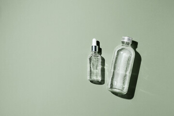 Dropper glass Bottle Mock-Up. Body treatment and spa. Natural beauty products. Eco cream, serum, skin care blank bottle. Anti-cellulite massage oil. Oily cosmetic pipette