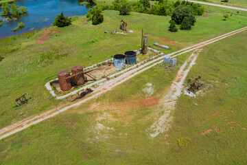 Oil pump on wide open prairie in Oklahoma USA an oil well pump jack pumping