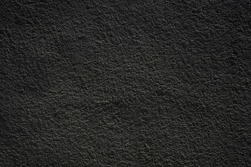 Black stucco texture background. Acrylic plaster facade closeup
