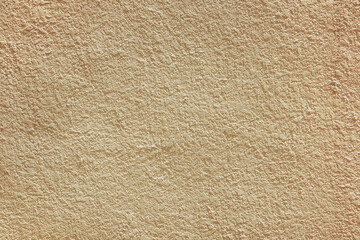 Beige brown stucco texture background. Acrylic plaster facade closeup