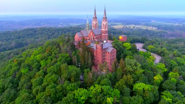 Holy Hill Basilica, quiet beauty and soaring architecture in the twilight sky, moving aerial view.
