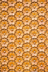 Fototapeta premium Fragment of a carved wooden door with a carved embossed floral ornament