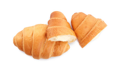 Delicious croissants with cream on white background, top view