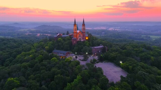Holy Hill Basilica, quiet beauty and soaring architecture in the twilight sky, moving aerial view.
