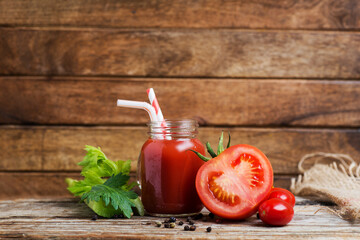Sliced juicy tomato and tomato juice with celery