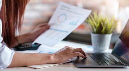 Business woman working in finance and accounting Analyze financial budget at home , Work from home concept