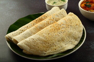 Homemade delicious Indian masala dosa served with coconut chutney and  sambar dish.