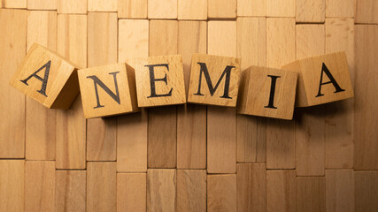 The word anemia was created from wooden letter cubes. Illness and health