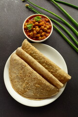 Homemade Indian meal- Healthy wheat flour chapati served with chickpeas, chana masala curry .