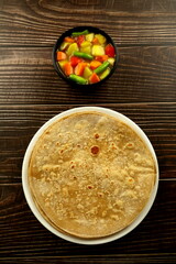 Homemade delicious Indian breakfast- organic whole wheat chapati served with vegetable curry.