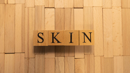 The word skin was created from wooden letter cubes. Disease and health.