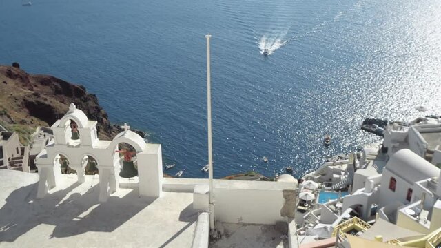 Small white bell-tower in Santorini