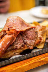 Delicious American barbecue platter, steak, bacon, sausage and fries platter