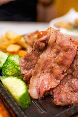 Delicious American barbecue platter, steak, bacon, sausage and fries platter