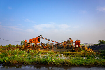 Sand mine escalator. Industrial equipment in the nature. Heavy tool for mine 