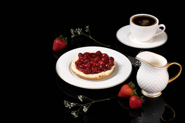 Cherries cheese cake and black coffee.