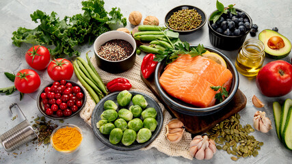 Selection of healthy food on light gray background. Clean eating concept.