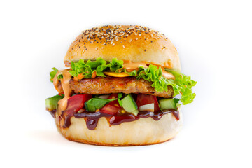 Fresh tasty burger with chicken, salad and cheesee, sauces on white background. Fat unhealthy street food.