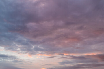 Naklejka na ściany i meble Stormy clouds on the sky at sunrise time.