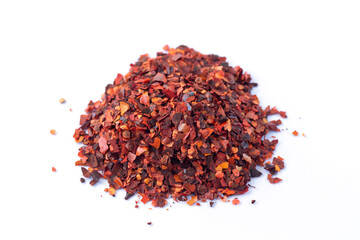 Crushed red chilli pepper cayenne flakes isolated on white background
