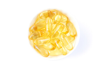 Bowl of cod liver or fish oil capsules with omega 3