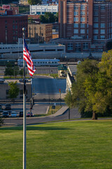 Kansas City near Union Station with US flag at sunset