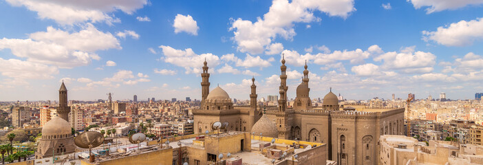 Panoramic shot of minarets and domes of Sultan Hasan Mosque and Al Rifai Mosque in Cairo, Egypt