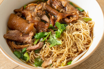 Stewed pork leg noodles in brown soup