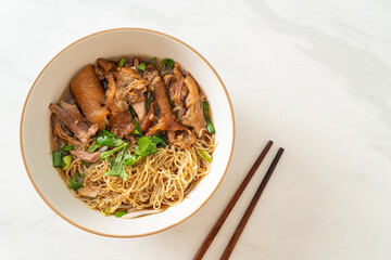 Stewed pork leg noodles in brown soup