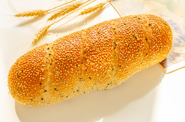 French bread Baguette with sesame seed close up. Healthy diet.