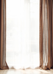 Light curtains on window in room